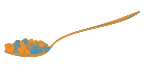 Spoon with pills and capsules